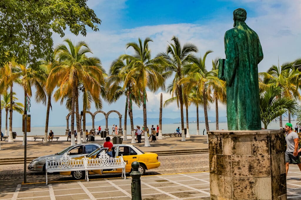 PUERTO VALLARTA, MEXICO - SEPTEMBER 6, 2015: Unidentified people on the street of Puerto Vallarta in Mexico. It is a resort town on Pacific coast, known for its beaches, water sports and nightlife.